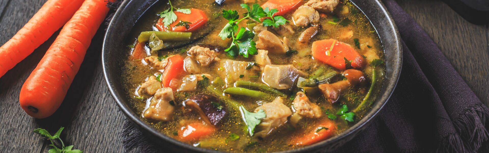 Homemade meat and vegetable stew or soup with mushrooms