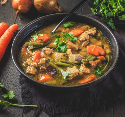 Homemade meat and vegetable stew or soup with mushrooms